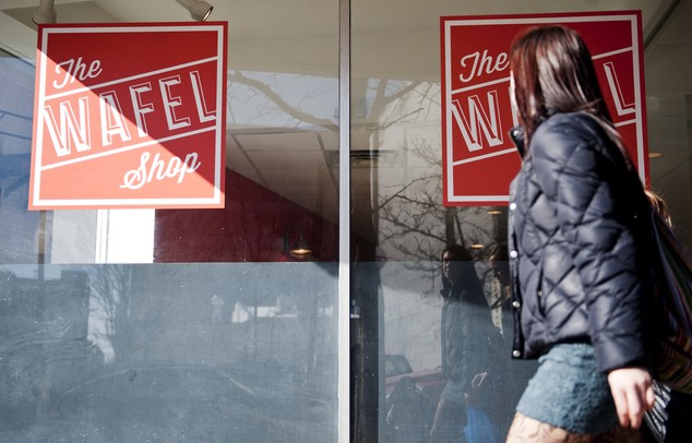 A pedestrian walks by The Wafel Shop on Friday, March 8. The restaurant opened on February 4. Daniel Brenner I AnnArbor.com
